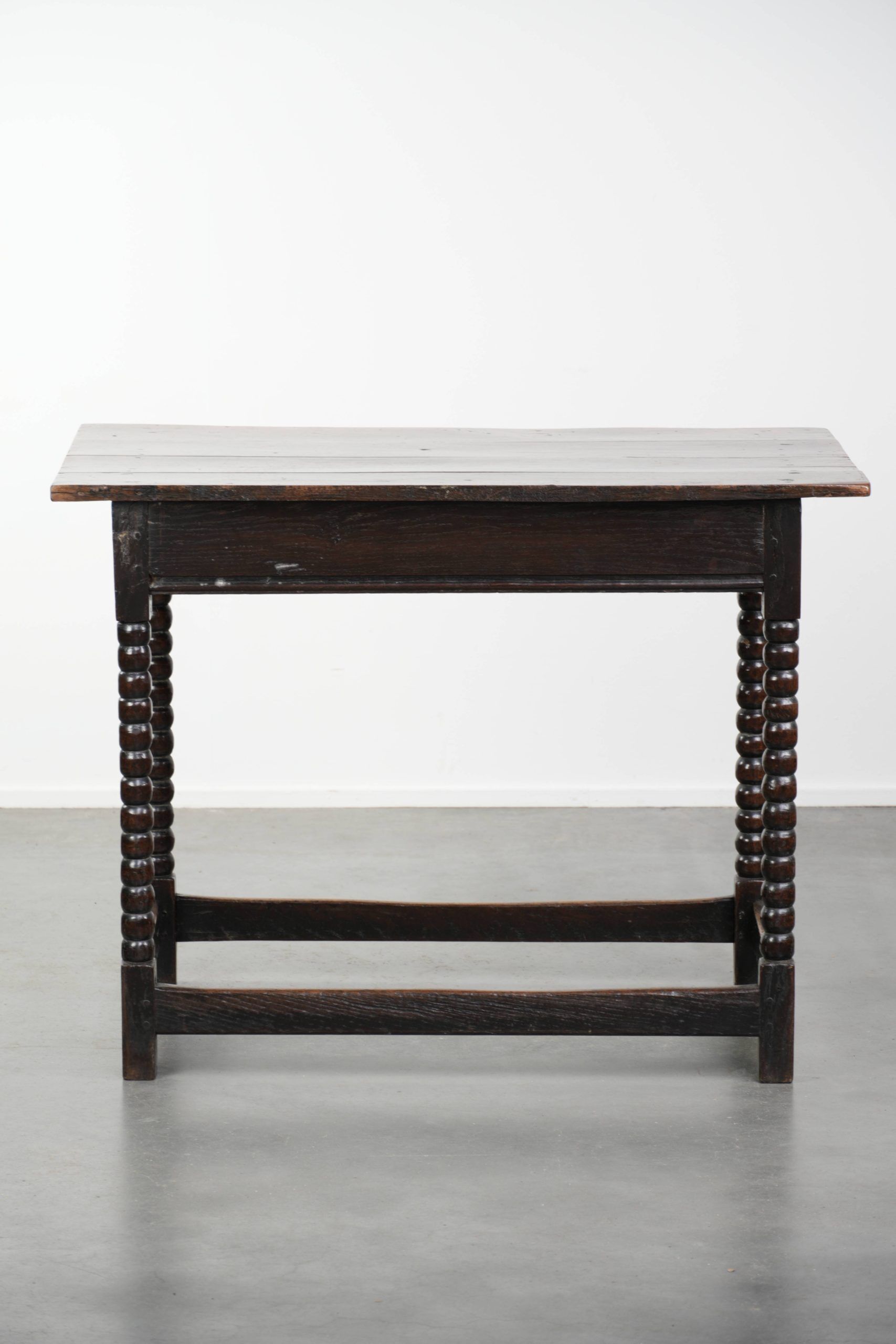 Antique English oak side table from the 18th century with bobbin legs