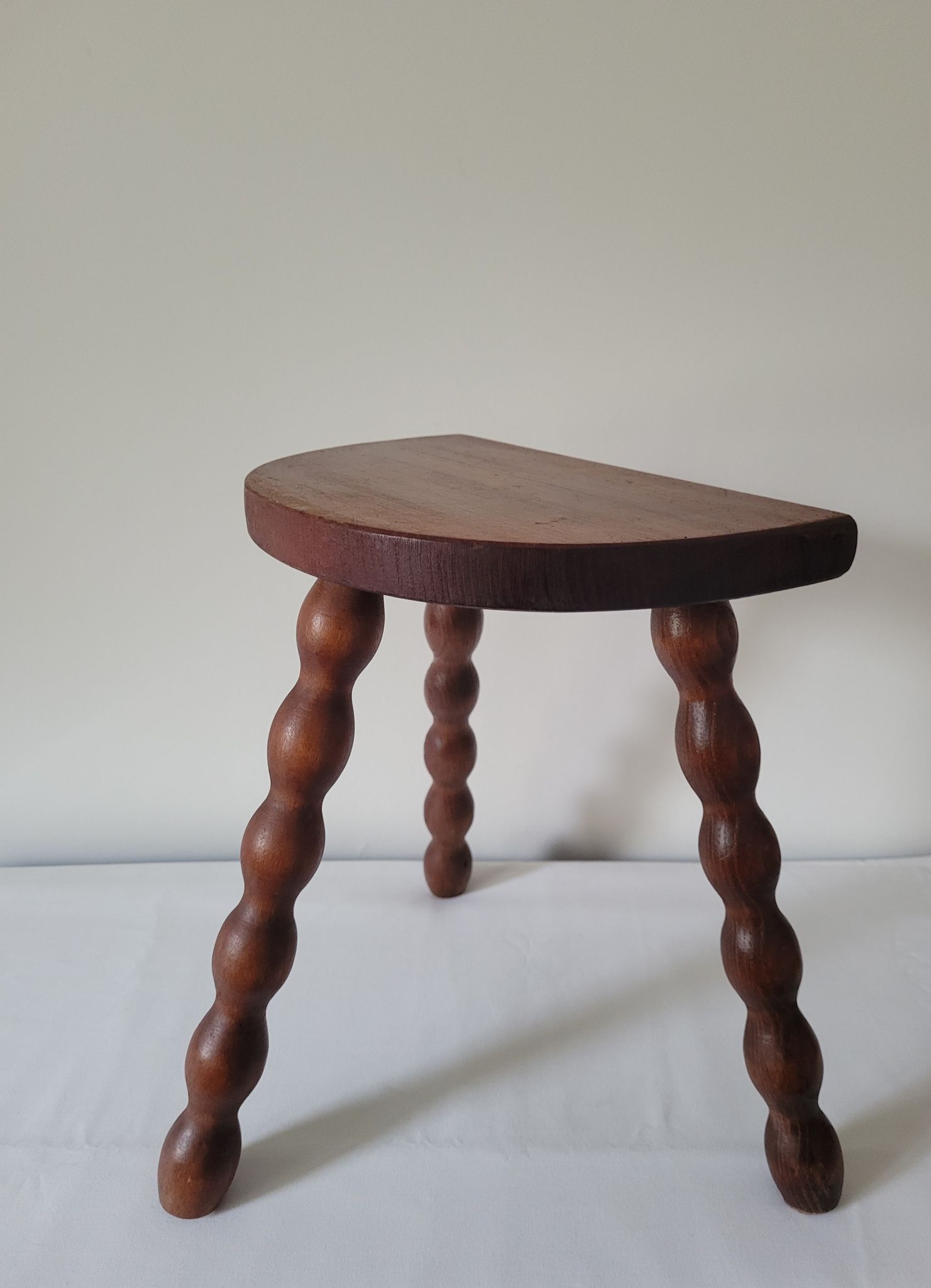 Brutalist stool turned wooden feet