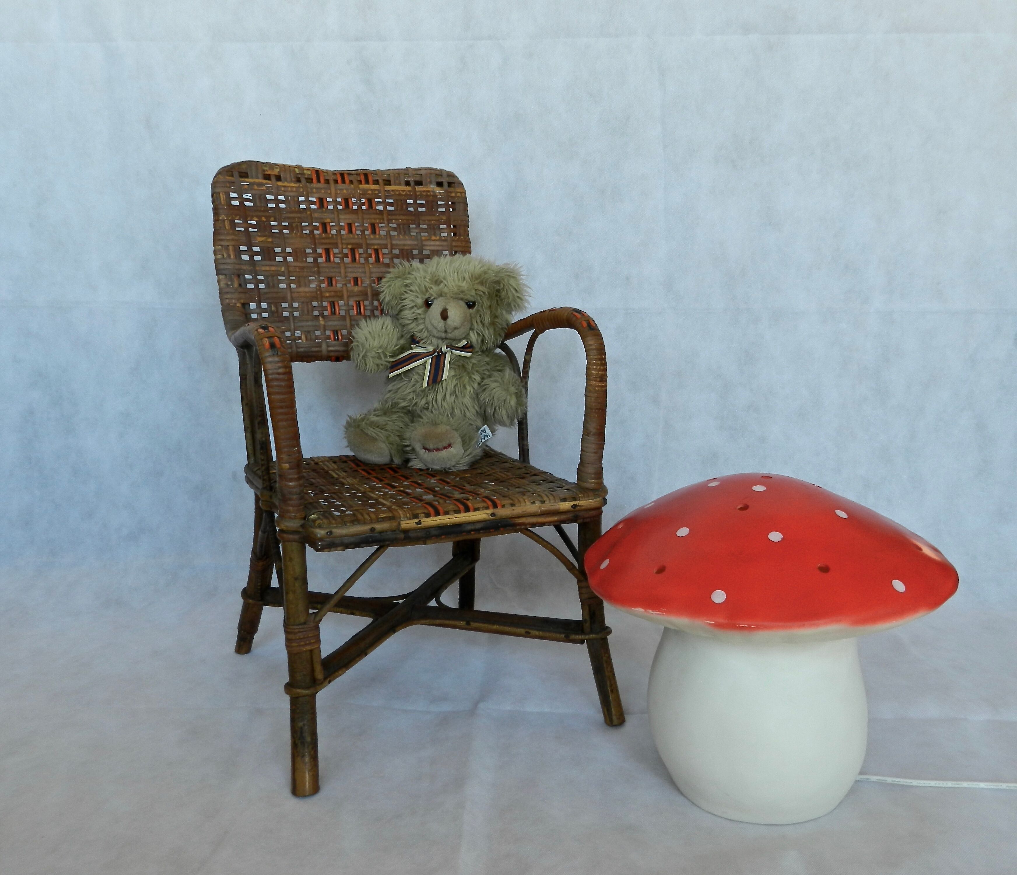 Small child vintage armchair in rattan