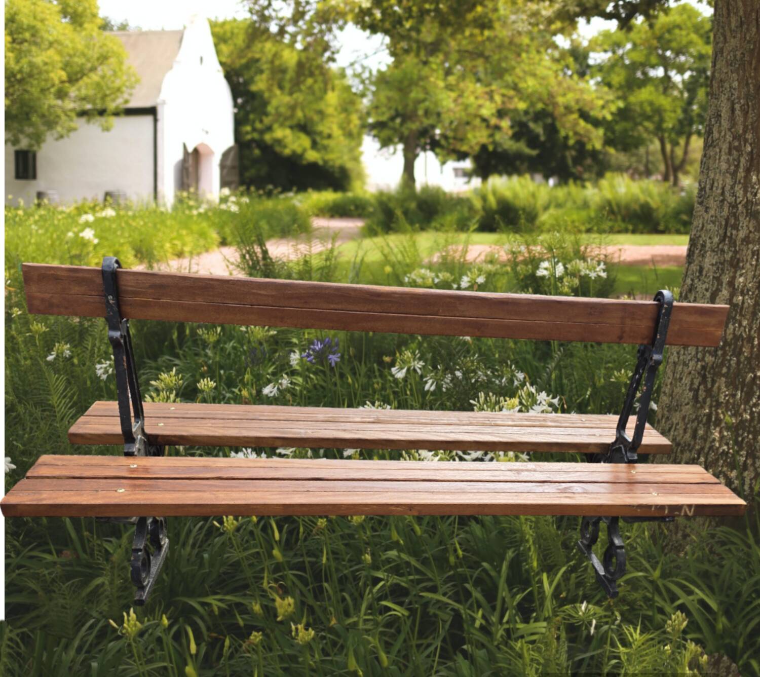 Antique double garden bench from the city of Paris in cast iron and wood