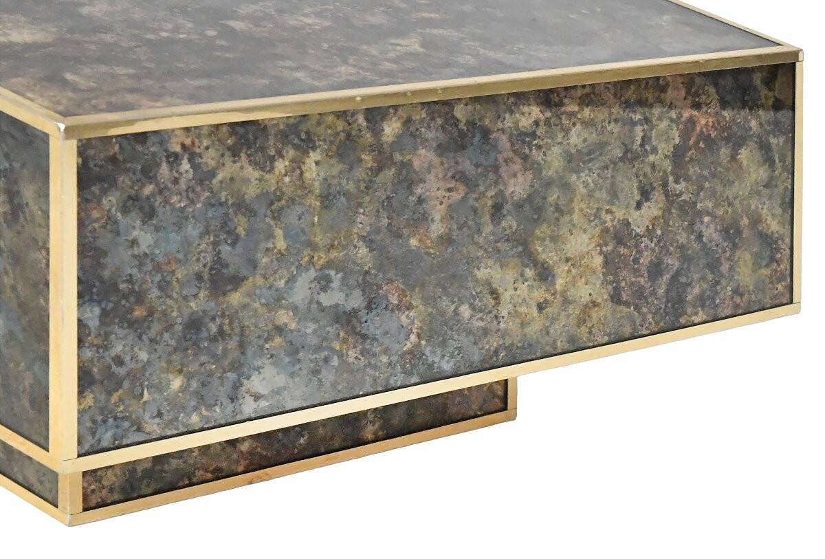 Marble glass coffee table with "solar eruption" decor.