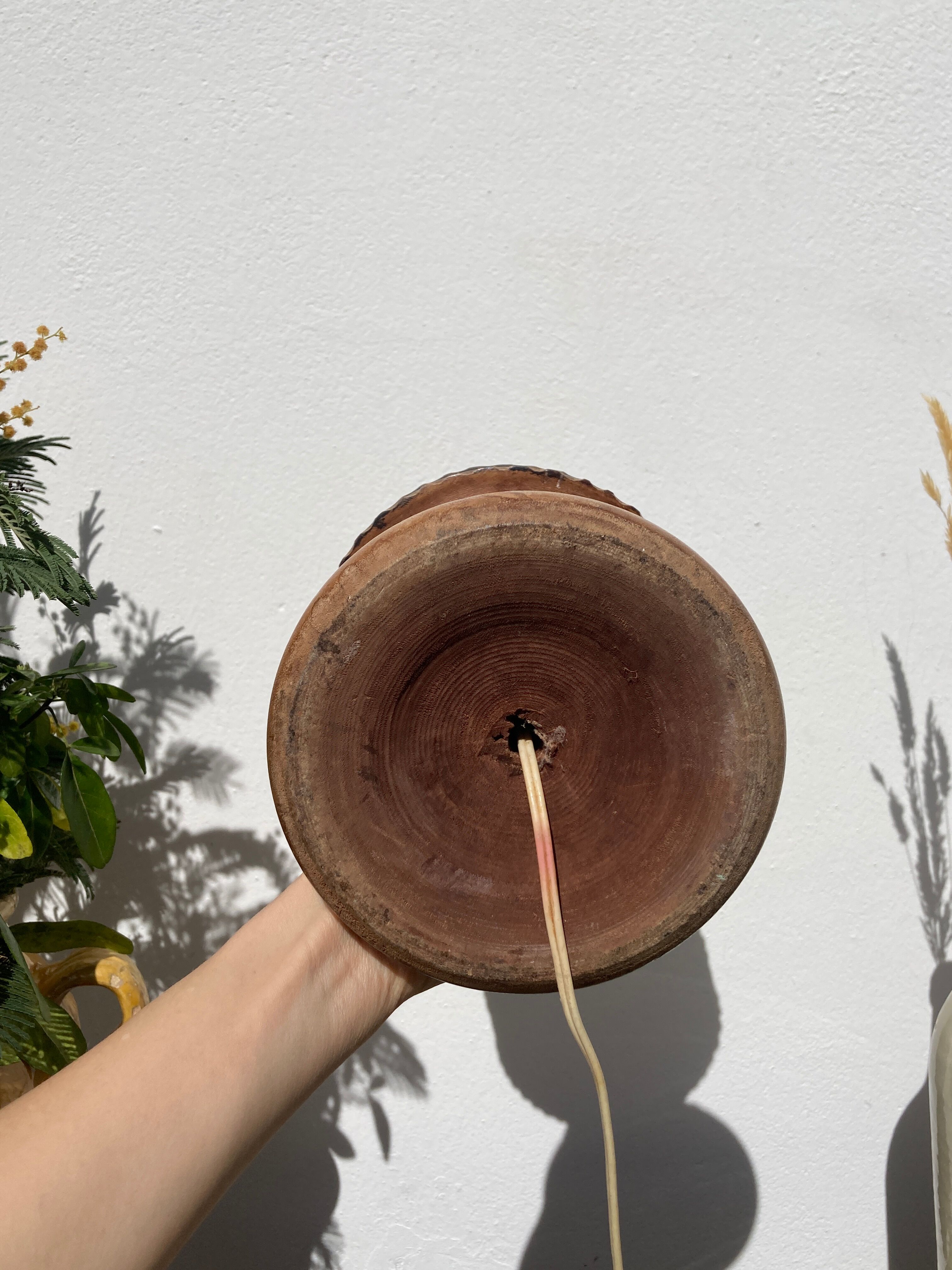 Foot of turned wooden lamp and carved