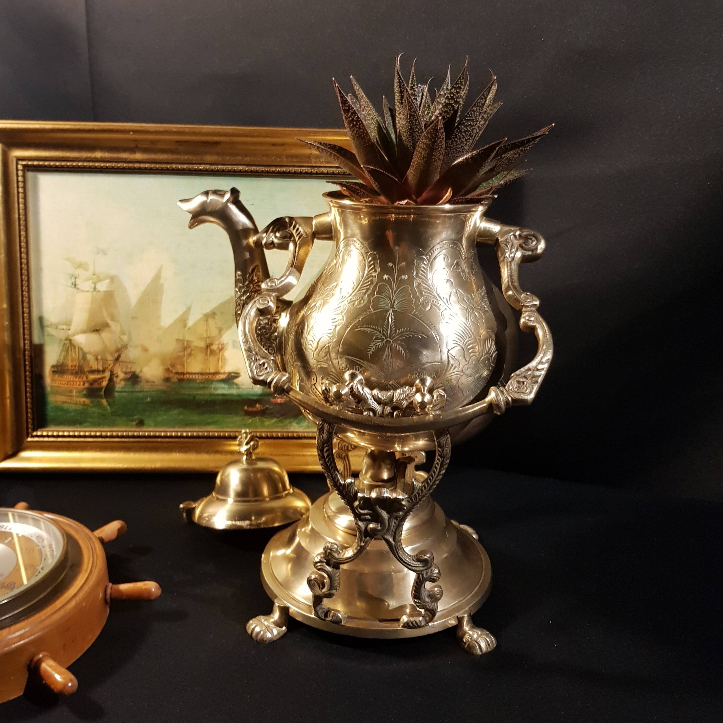 Oriental teapot on its support