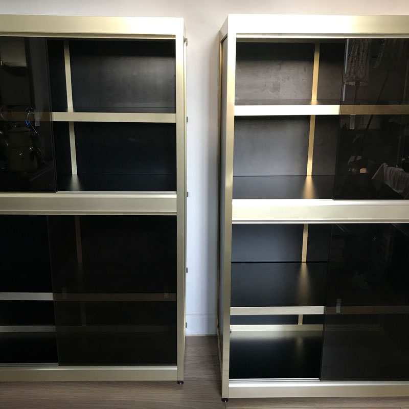 Shelves of black and gold windows