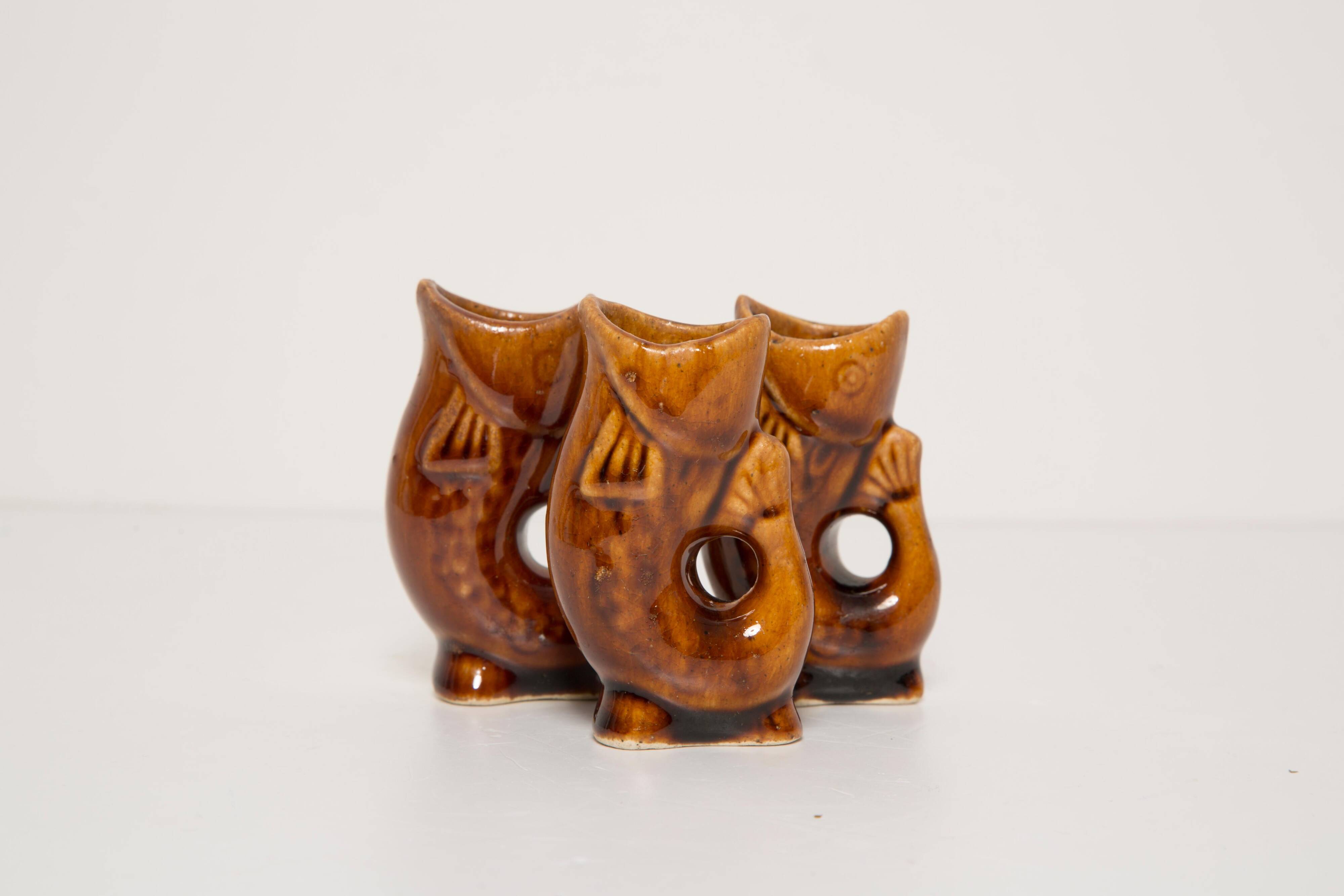 Set of three small brown glass fish, 20th century, Europe, 1960s