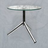 Modernist tripod side table in tempered glass and chrome metal.