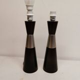 Two table lamps made of dark-stained wood with silver detail in the middle.