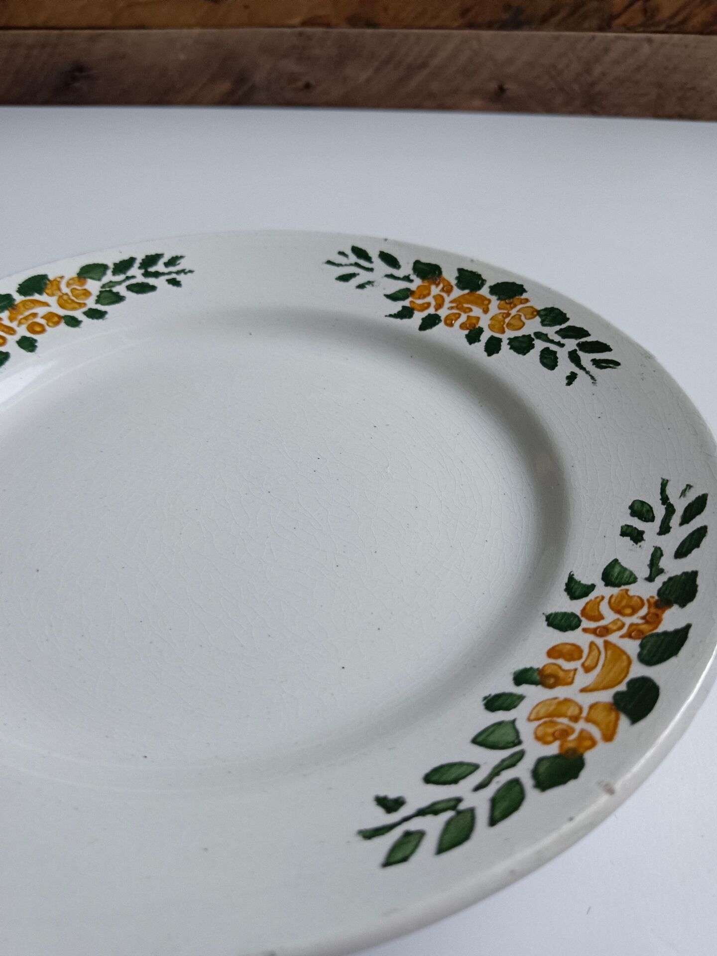 Old round footed plate signed Labrut brothers flowers