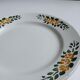 Old round footed plate signed Labrut brothers flowers