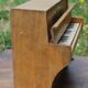 Ancient toy, wooden piano, decorating birds on rose bush