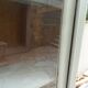 Renovated Art Deco display cabinet in grey-green.