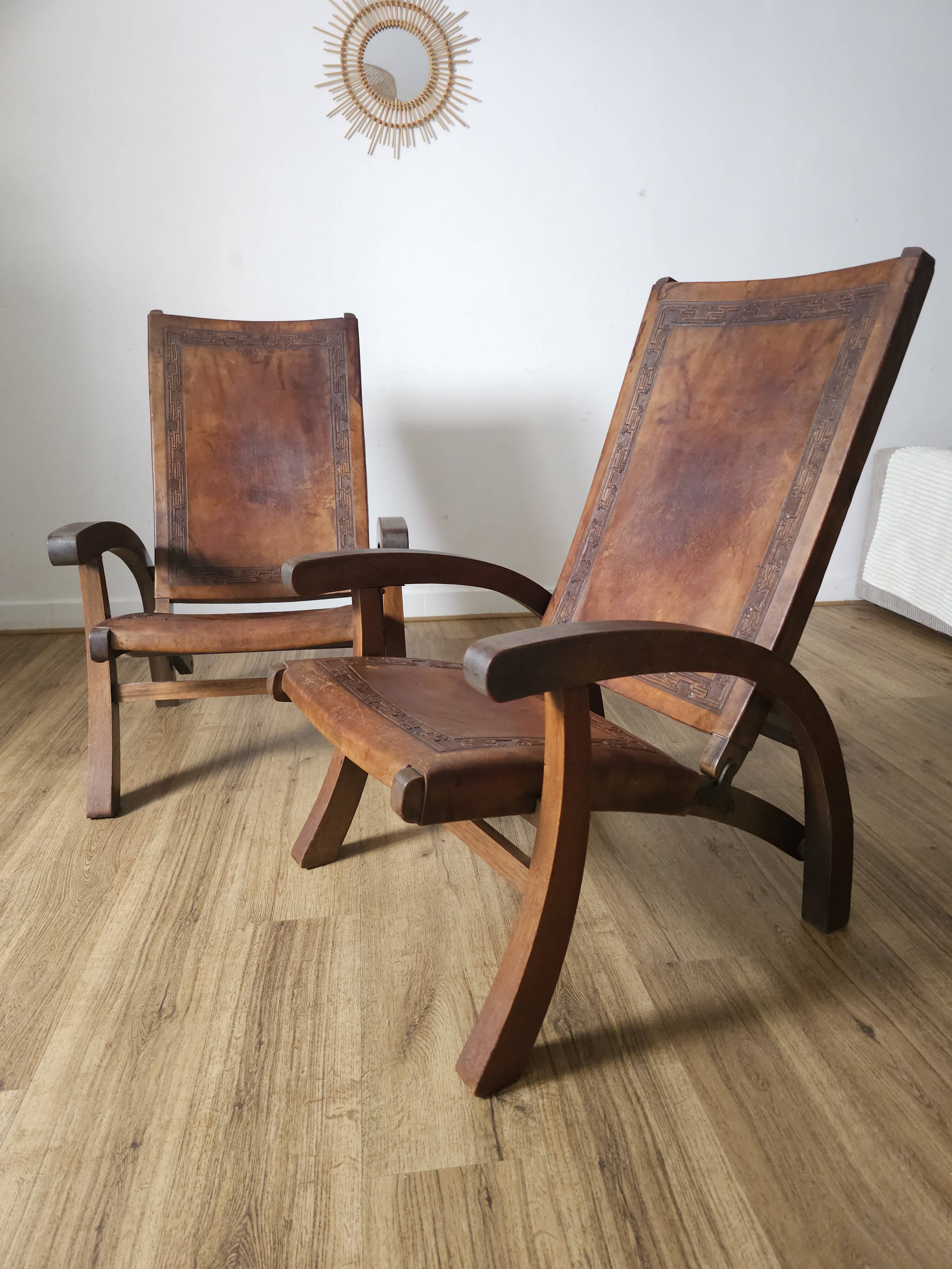 Leather and teak armchairs, by Angel Pazmino, circa 1960.