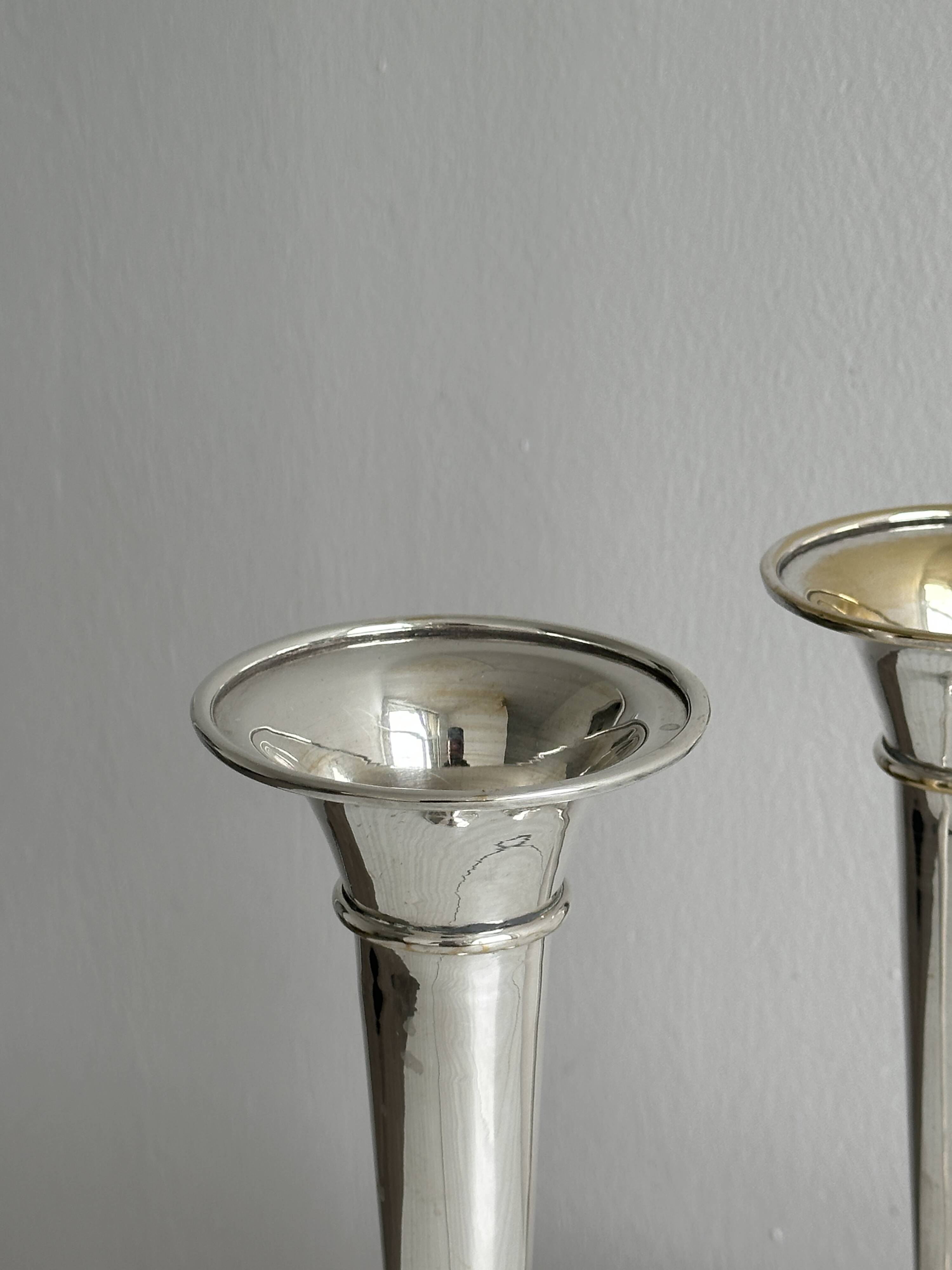 2 large patinated metal soliflores