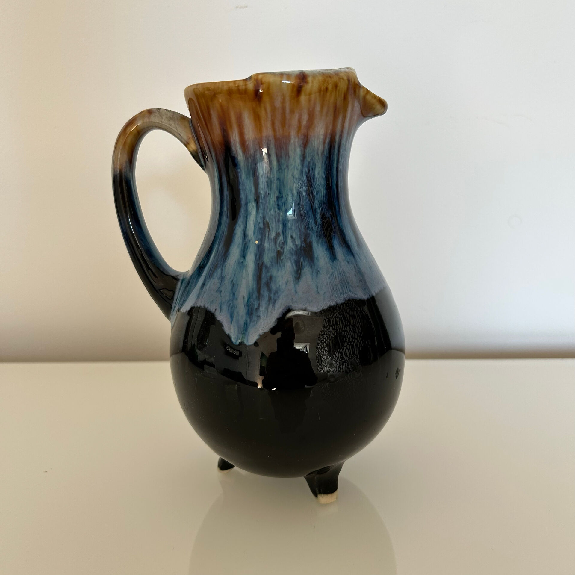 Flamed blue tripod jug