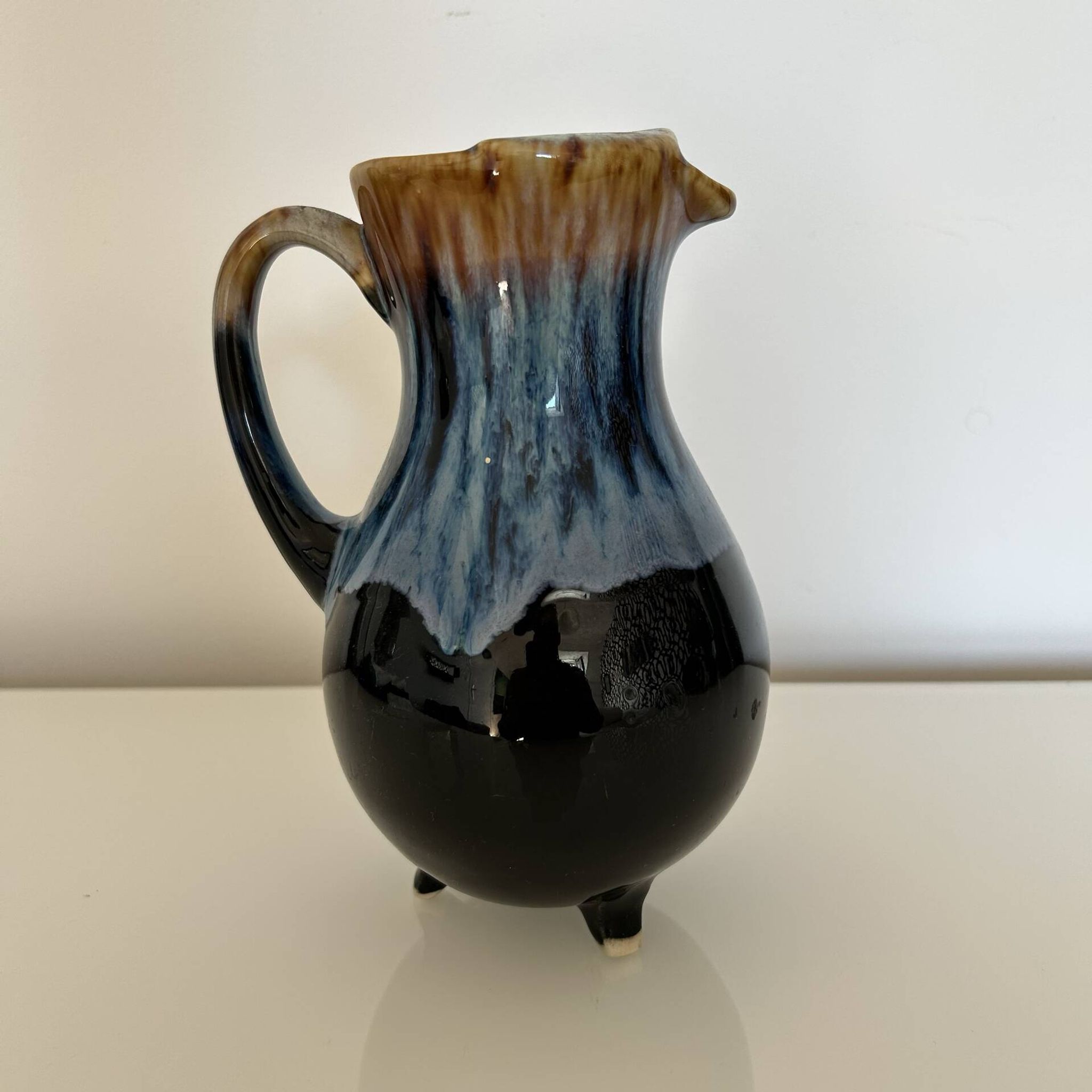 Flamed blue tripod jug