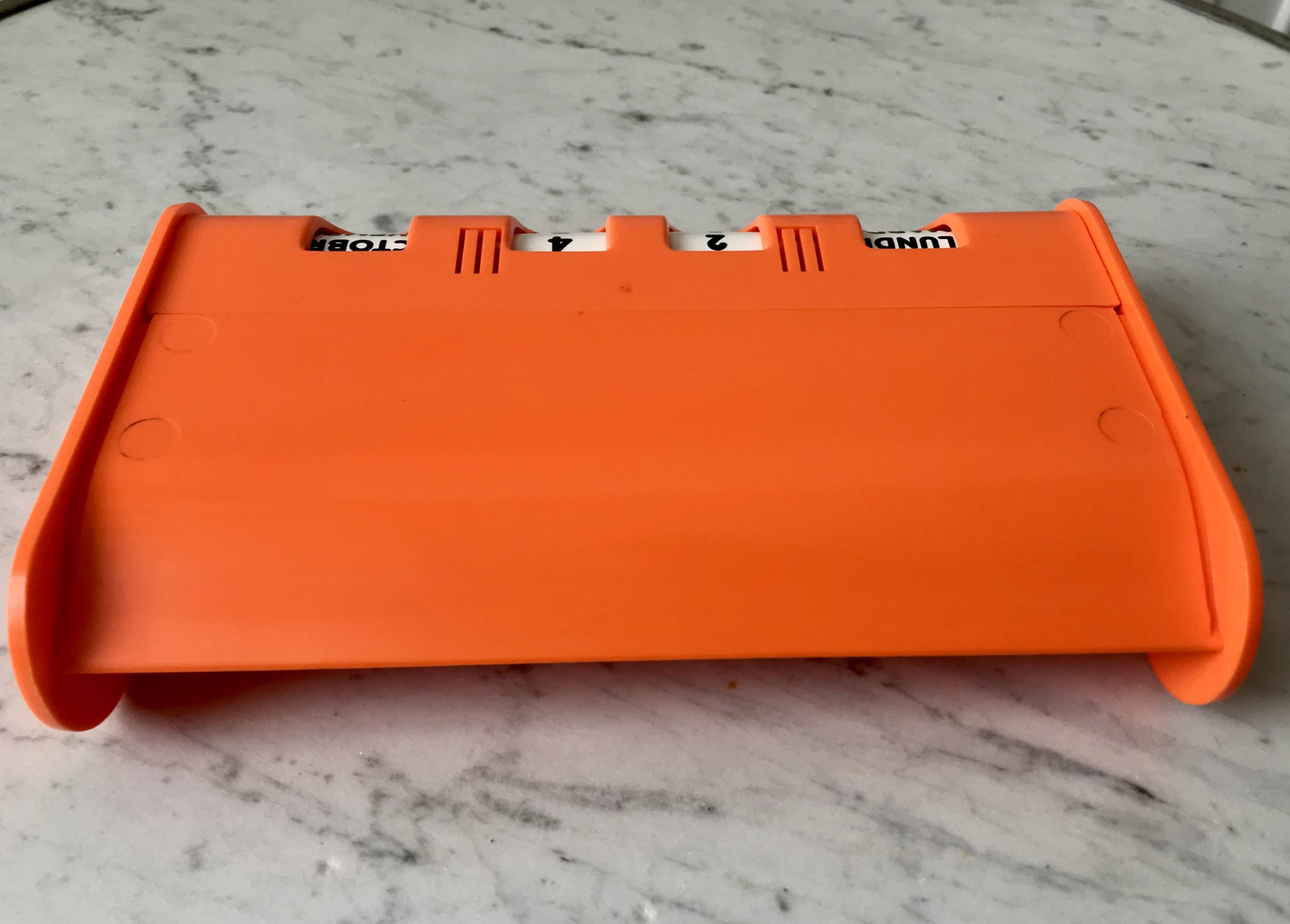 Dater empty pocket in orange plastic seventies 70s