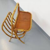 Side table with vintage rattan and wood magazine rack from the 60s