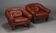 Pair of dark caramel leather armchairs