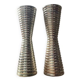 Pair of diabolo candlesticks in silver metal