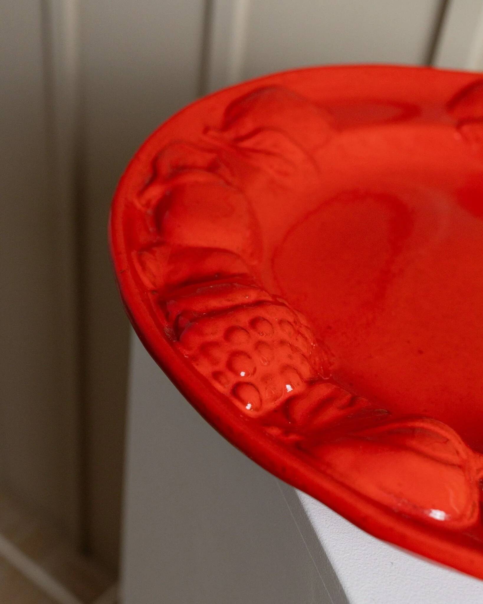 Red glazed ceramic fruit platter with three-dimensional fruit relief, vintage Italy 1980s, Mid-Century design