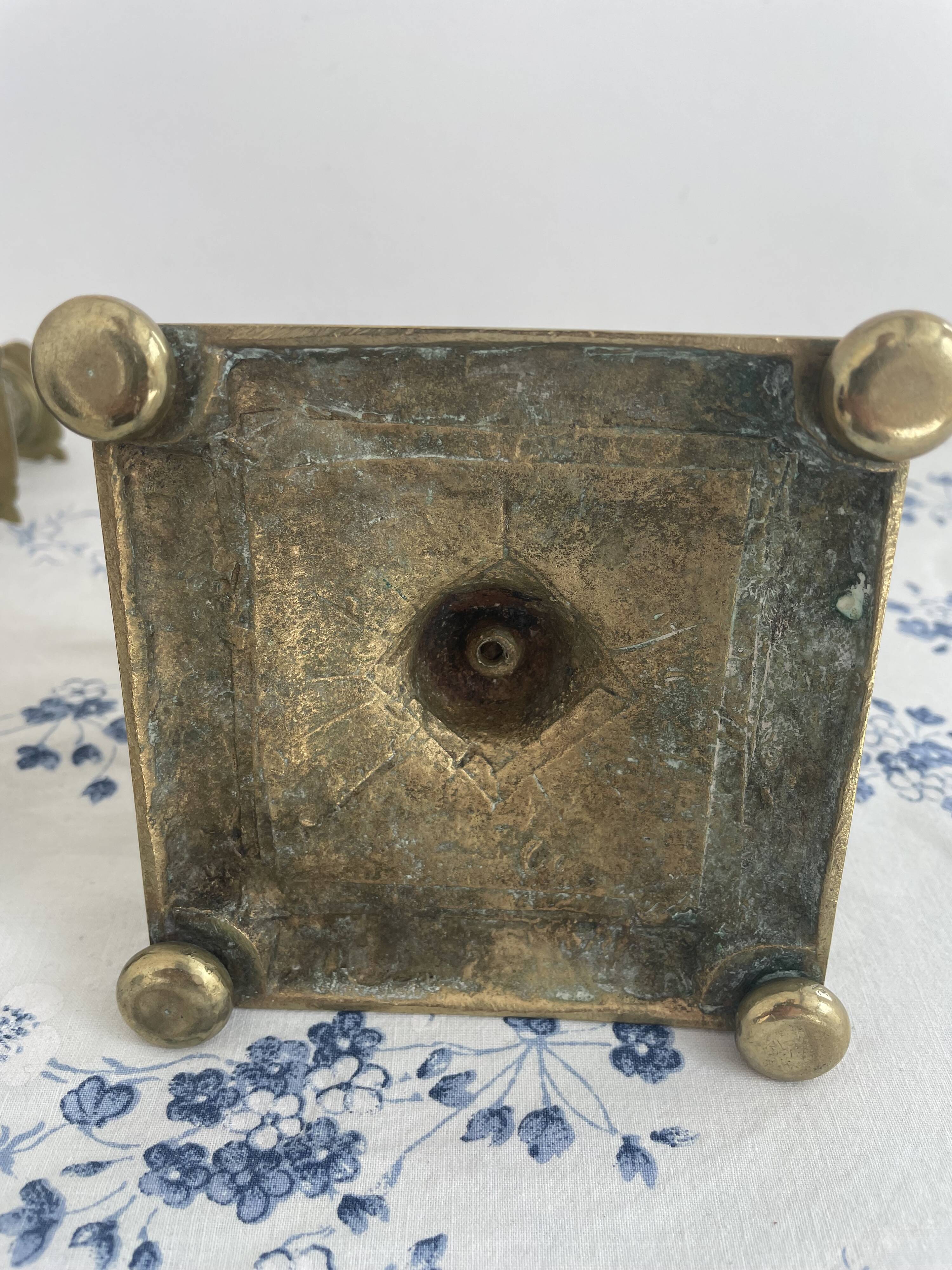 Pair of brass dolphin candlesticks, late 19th century, Napoleonic period