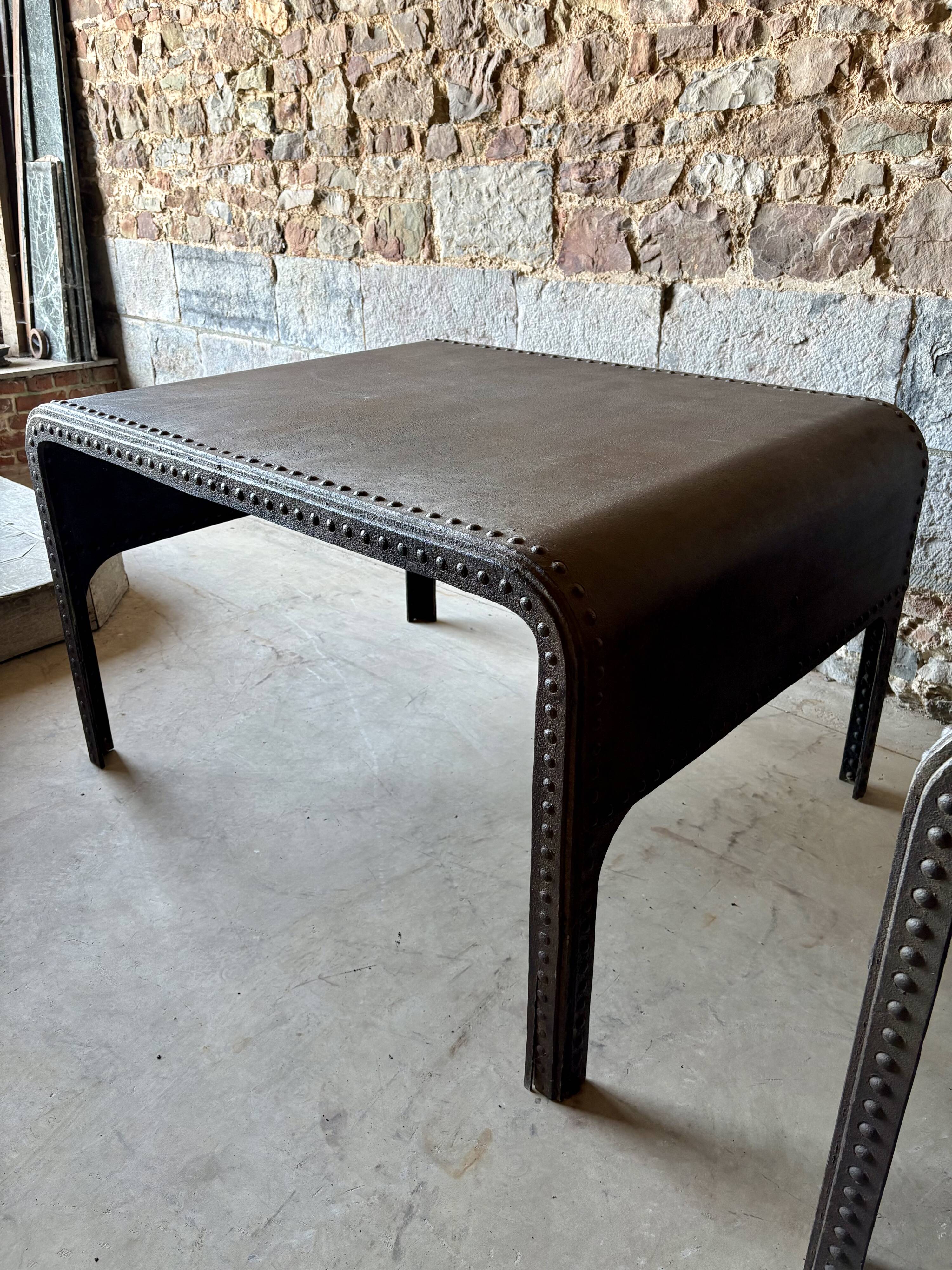 Pair of large riveted metal industrial tables