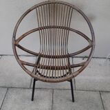 Shell-shaped armchair in rattan with metal legs. Caravane brand.