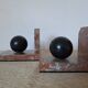 Pair of red marble bookends with black stone spheres – Art Style