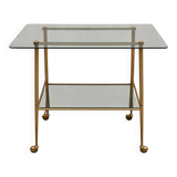 Vintage 1970s glass and gold rolling console table.