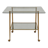 Vintage 1970s glass and gold rolling console table.