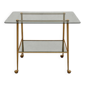 Vintage 1970s glass and gold rolling console table.