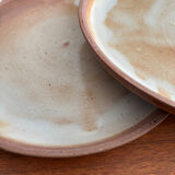 Set of vintage 1970s beige ceramic dinner plates.