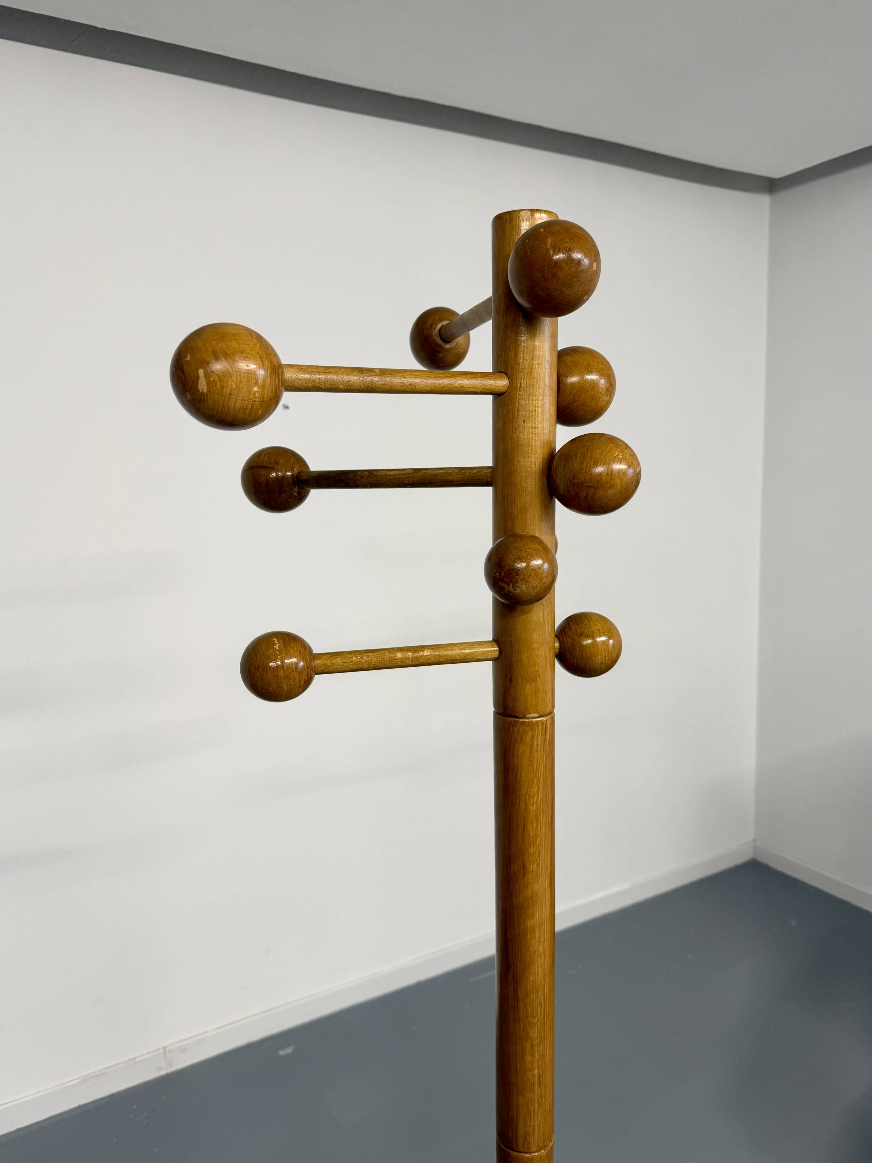 Vintage wooden coat stand with modernist design from the 1970s.