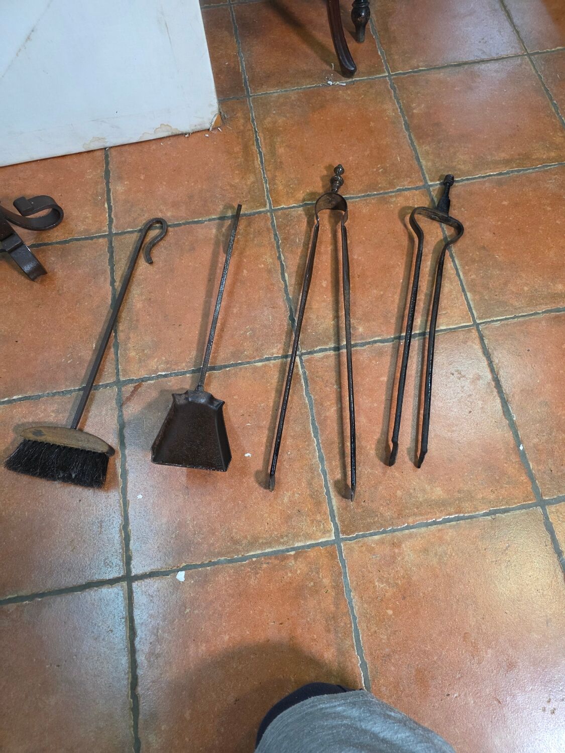 Antique fireplace set in solid wrought iron and brass.