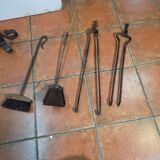 Antique fireplace set in solid wrought iron and brass.