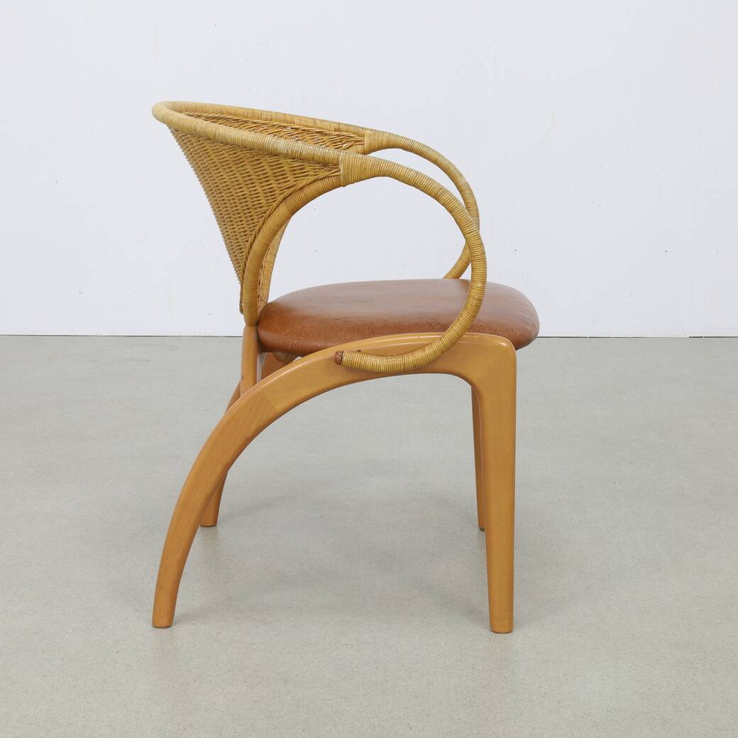 Pair of leather and rattan chairs by Lübke