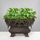 Cast Iron planter decorated with masks and lion paws, France 1850s