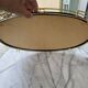 Vintage oval mirror plateau in gilded brass & black scoubidou — 1970s