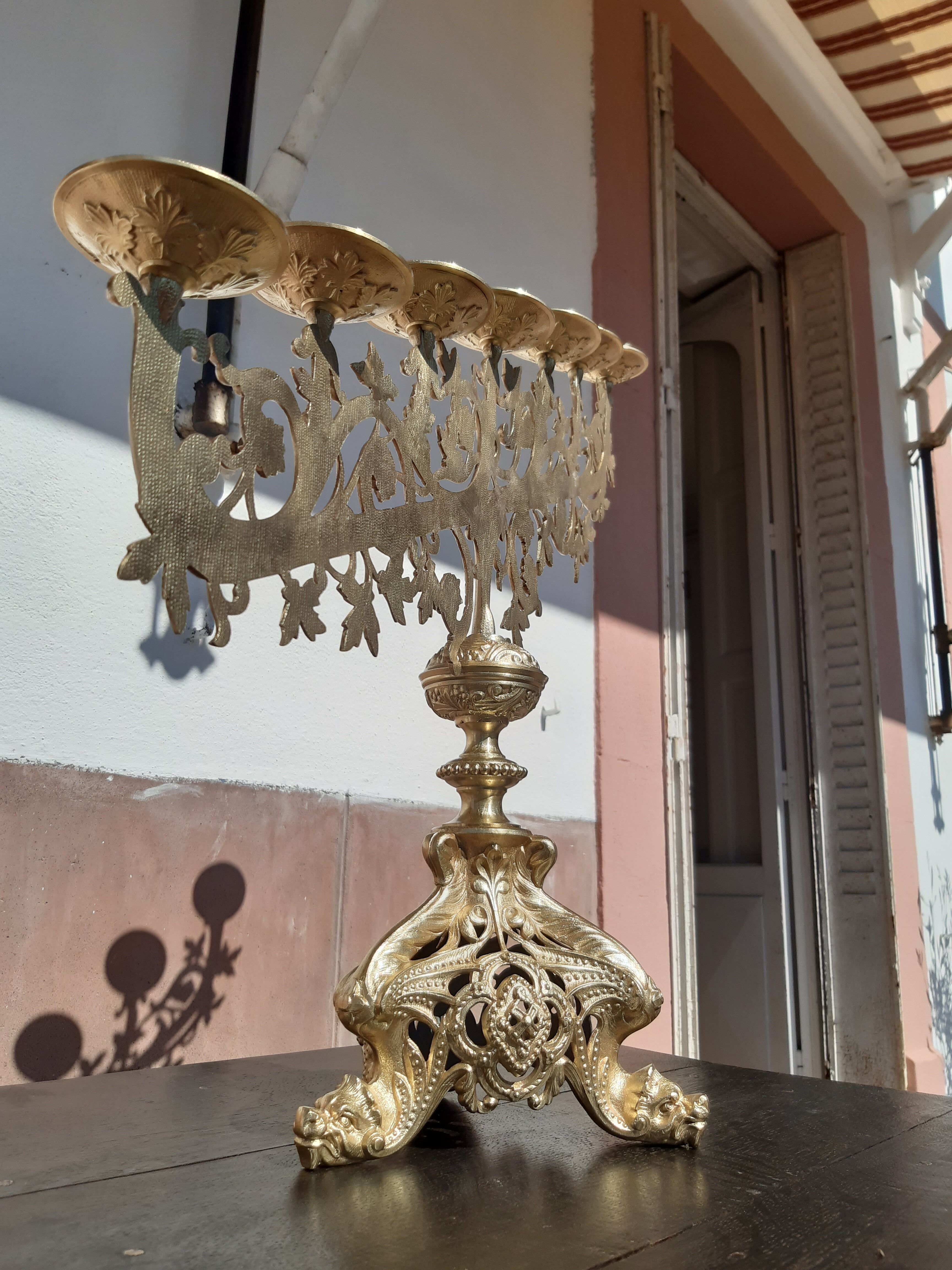 Antique candle holder in bronze and brass nineteenth century.