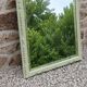 Large antique bevelled mirror in carved solid wood, green lizard – 129 × 75