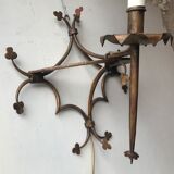 Pair of gilded metal sconces decorated with clovers.