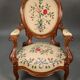 Pair of Louis Philippe armchairs with petit point upholstery.