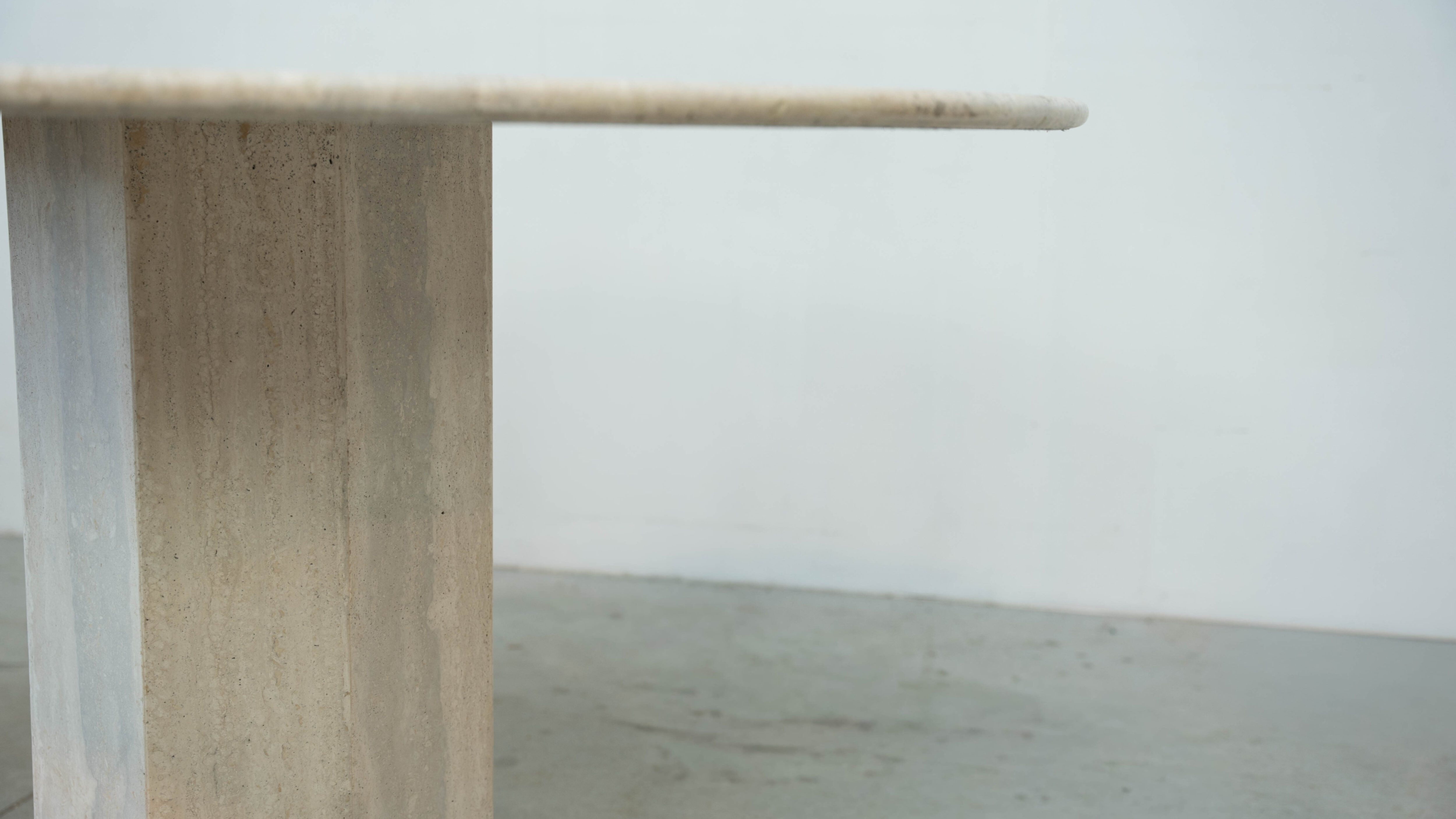 Round Belgian travertine dining table