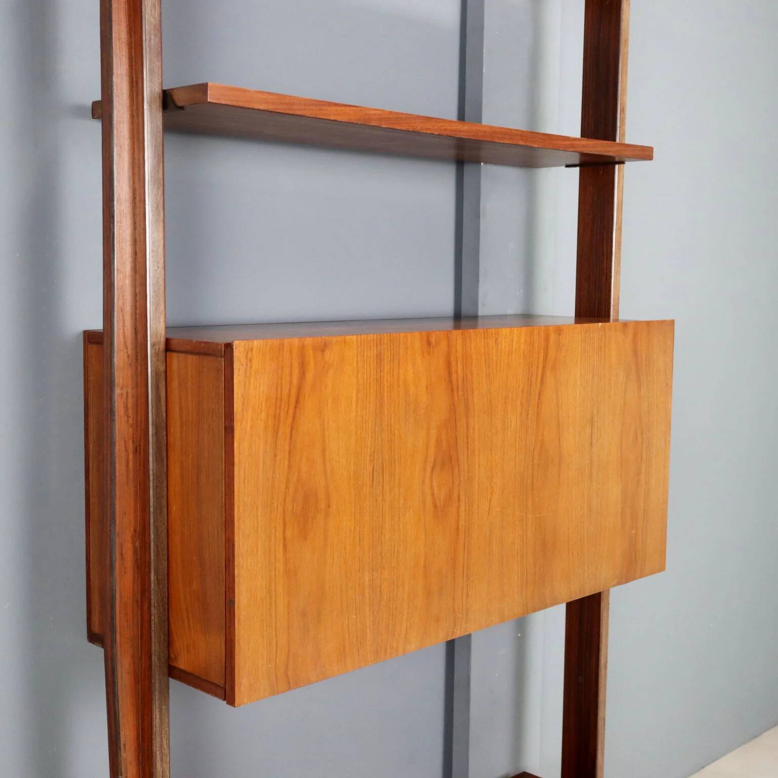 Vintage library from the 1950s-60s with a bar compartment.