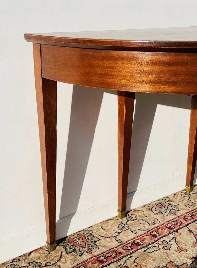 Empire-style demi-lune console from the 19th century.