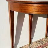 Empire-style demi-lune console from the 19th century.