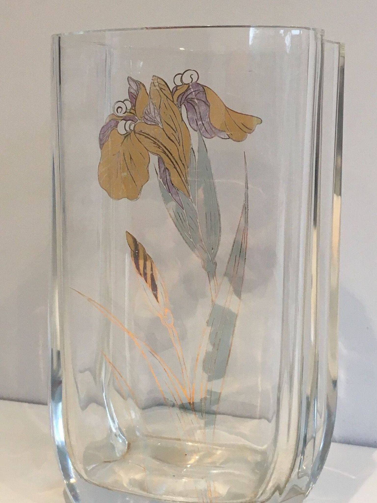Glass vase with a decoration of a golden flower, around 1970.