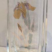 Glass vase with a decoration of a golden flower, around 1970.