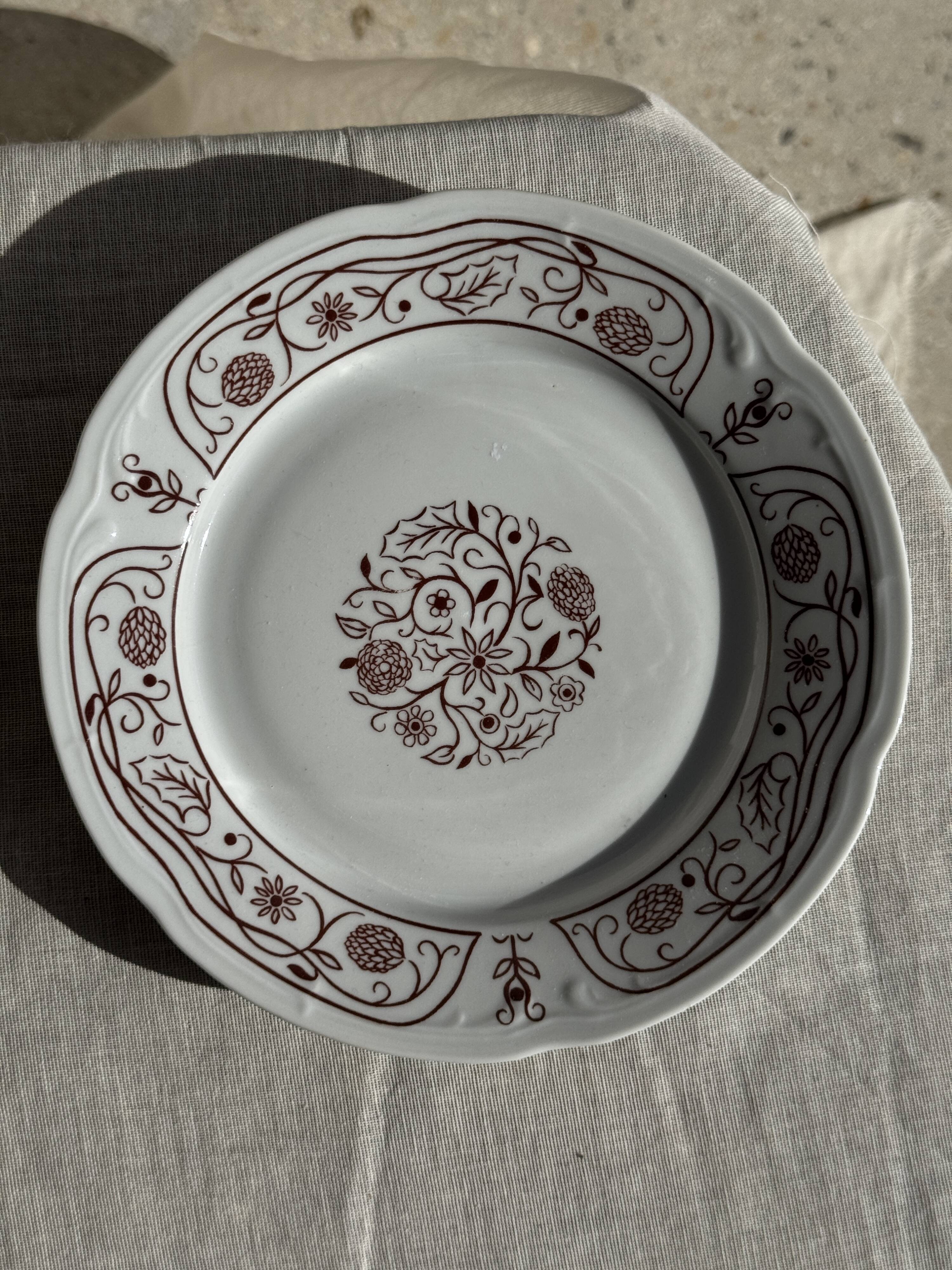 Set of 6 vintage dessert plates made in Poland with a plant motif.