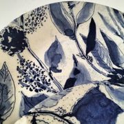 Two flat plates in earthenware with blue floral decoration.